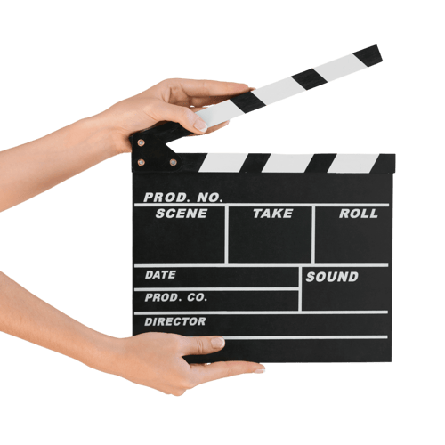 Hands holding an open clapperboard